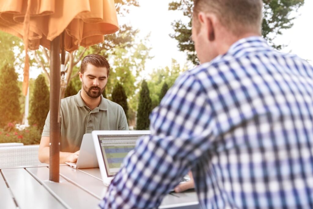 Employees utilizing top knowledge management software to centralize and organize company information for improved collaboration and efficiency